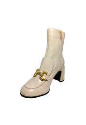 Scarpe Donna Tosca Blu Effetto verniciato, applicazioni in metallo, zip laterale, punta tonda, tacco squadrato e suola in gomma.